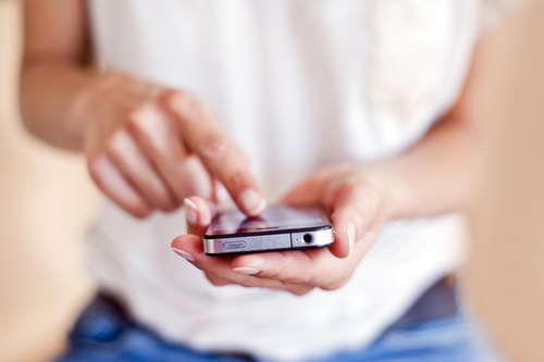 A woman uses her smartphone.