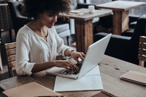 black woman working on laptop